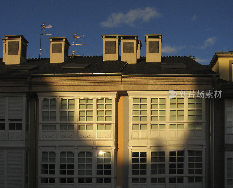 Modern apartment buildings , retro style traditional galerías Galicia, Spain.